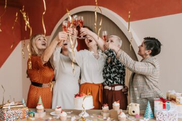 a group of women doing a toast